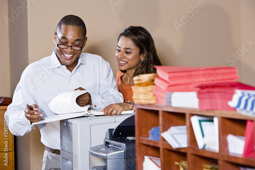 Multiracial office workers working on documents
