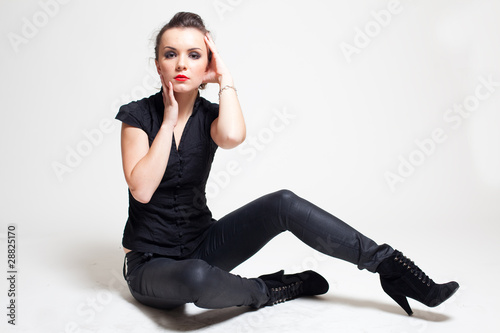 Sitting girl in black; photo
