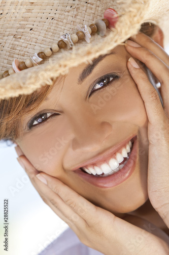 Beautiful Mixed Race Woman Laughing In Straw Coboy Hat photo