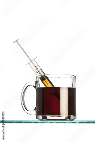 syringe in a cup of coffee