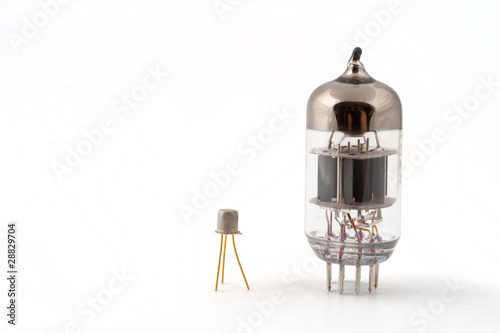 Transistor next to a vacuum tube photo