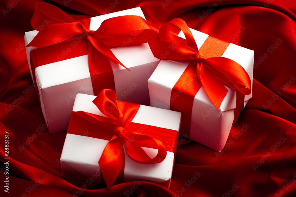 Whit gift boxes with red ribbon Whit gift boxes with red ribbon