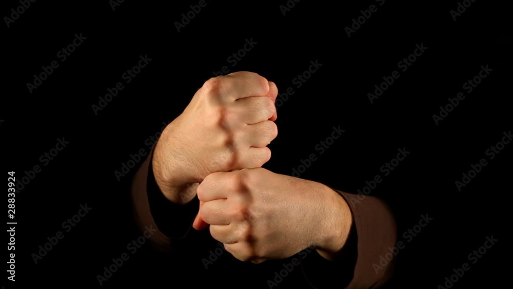 Strangulation gesture on black background Strangulation gesture on black background