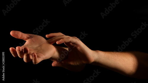 Radial pulse palpation gesture on black background photo