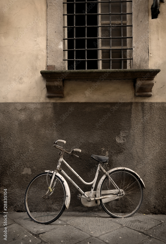 Italian old-style bicyle in Lucca, Tuscany Italian old-style bicyle in Lucca, Tuscany