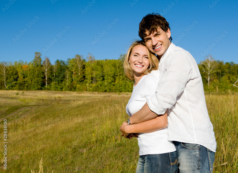 happy beautiful couple on nature