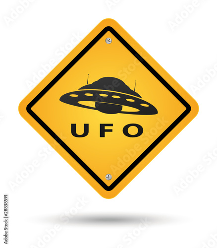 Sign in yellow beware with ufos