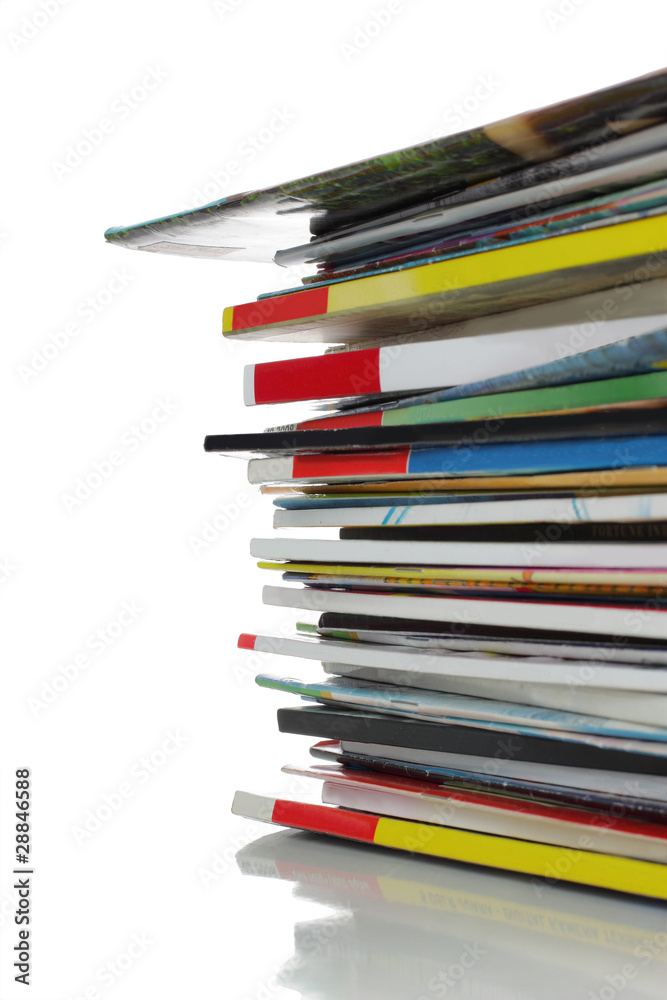 stack of colorful magazine over white background stack of colorful magazine over white background
