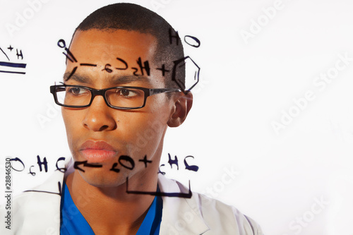 A young scientist works on a chemistry problem