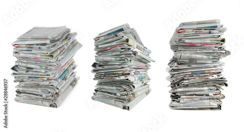 three different angle of stack of newspaper