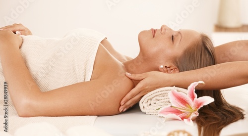 Young woman enjoying neck massage