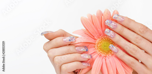 Glitter manicure and delicate pink flower