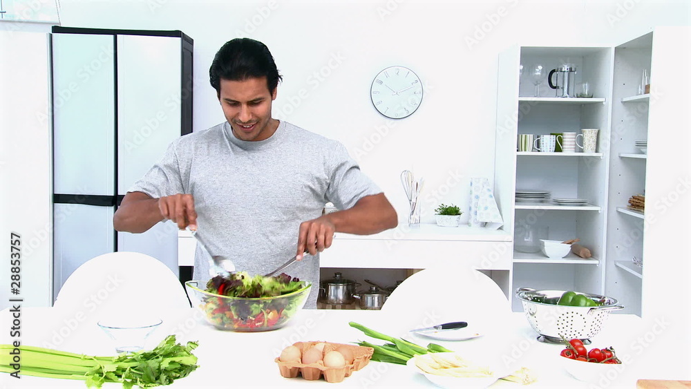 Man preparing a salad for lunch Man preparing a salad for lunch