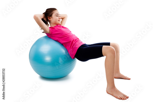 Girl exercising on white background