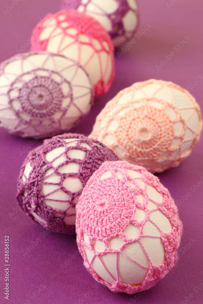 Easter eggs with beautiful pink and purple crochet decoration Easter eggs with beautiful pink and purple crochet decoration