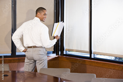African American businessman reading document