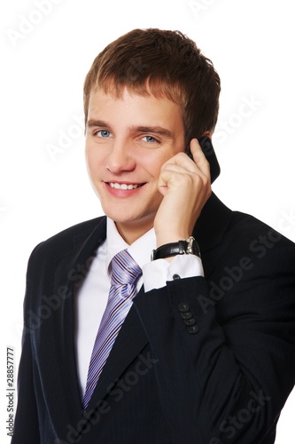 Young businessman talking on mobile phone