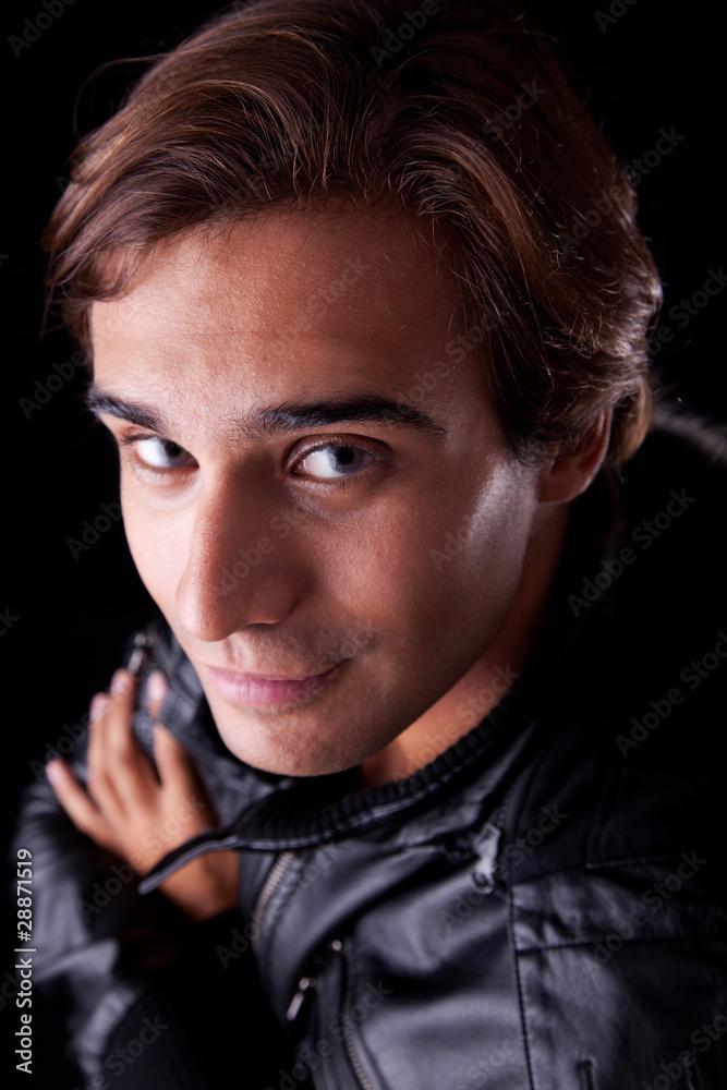 young man smiling and looking up young man smiling and looking up