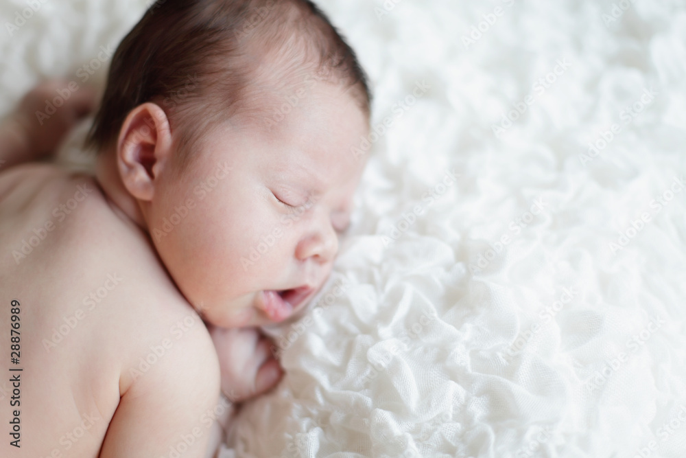Newborn baby sleeping. Soft focus, shallow DoF. Newborn baby sleeping. Soft focus, shallow DoF.
