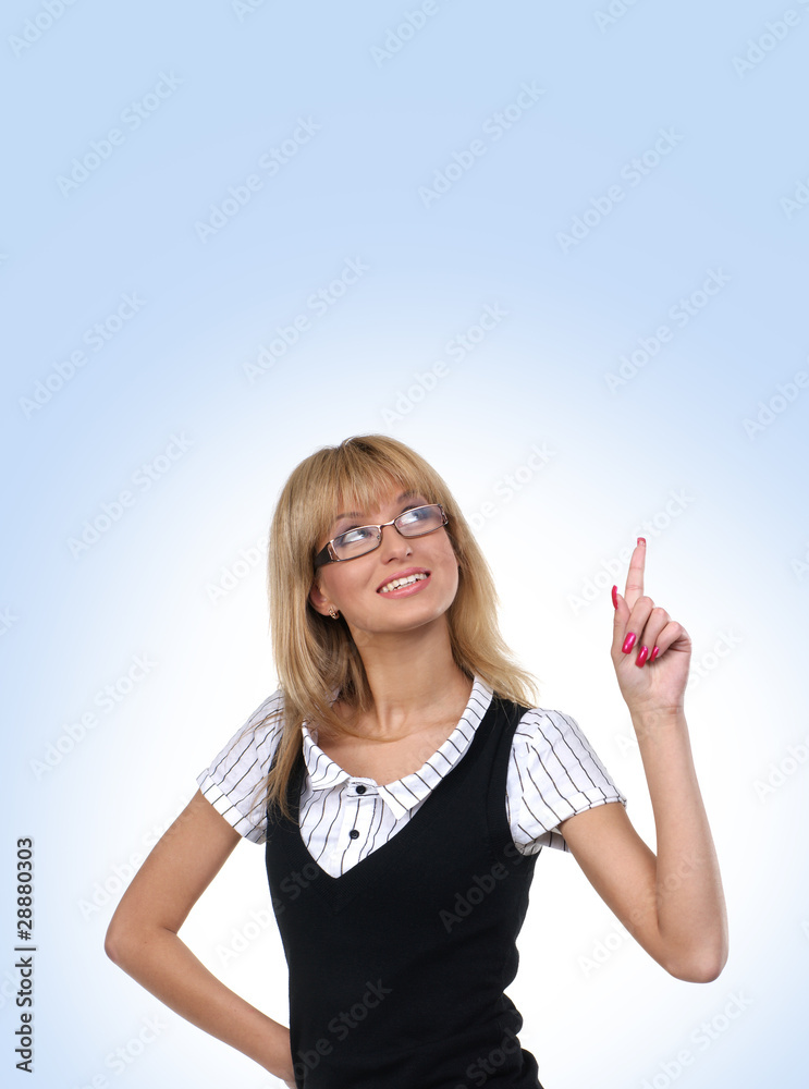 Fototapeta premium A young and happy blond businesswoman in formal clothes