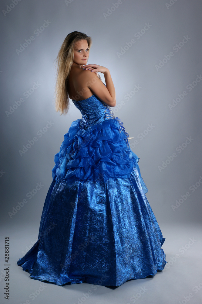 A young and sexy blond bride in a beautiful blue dress
