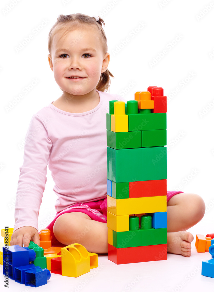 Little girl with building bricks Little girl with building bricks