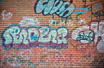 Acrylglasbilder Graffiti Graffiti on a brick wall  © Minerva Studio