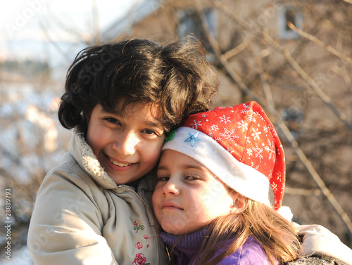 Closeup portrait of two happy little girls