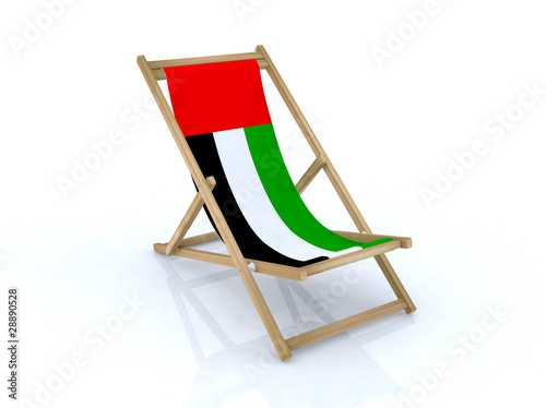 wood beach chair with united arab emirates flag photo