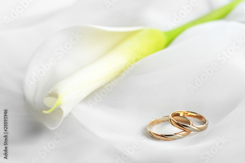 White  fabric and wedding rings