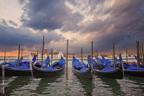 Gondolas bobbing in lagoon outside San Marco Piazza Venice Italy