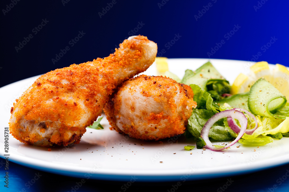 Roasted chicken drumsticks and vegetables