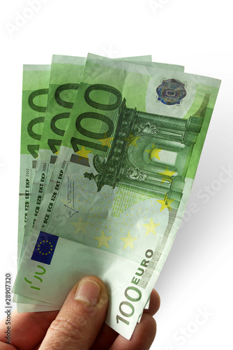 mano con banconote da cento euro su fondo bianco photo