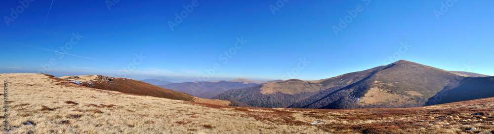 Autumn mountain meadows and peak view