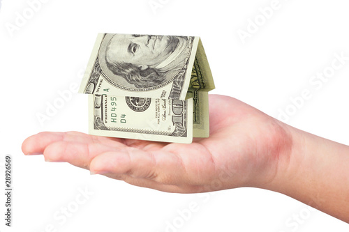 Kid's hand holdling money house photo