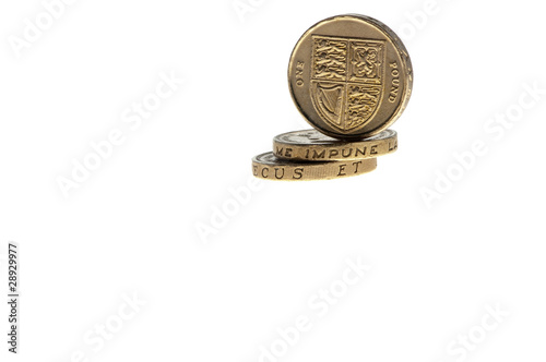 three £1 uk coins isolated on white