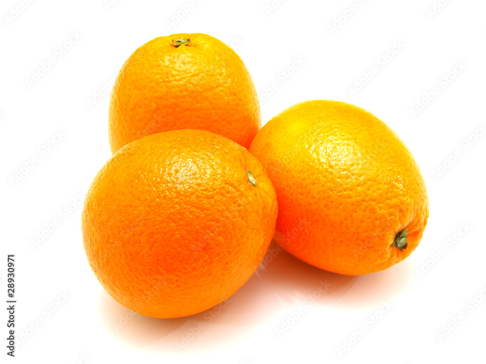 Three ripe oranges lie nearby on a white background Three ripe oranges lie nearby on a white background