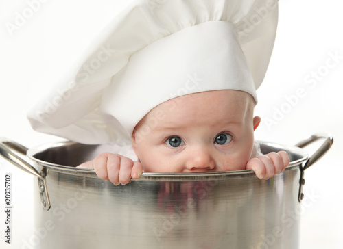 Close up of baby sitting in stock pot