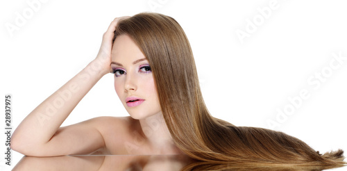 Portrait of beautiful teen girl with long straight hair