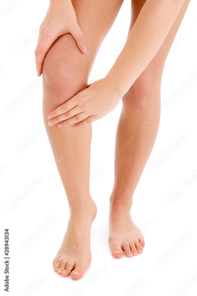 Woman massaging pain knee Woman massaging pain knee