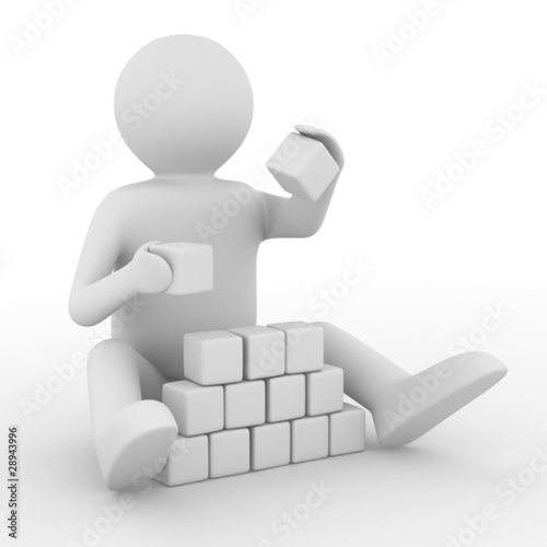 child plays cubes on white....