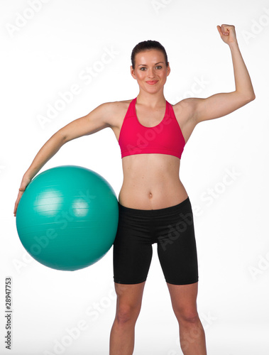strong woman with pilates ball