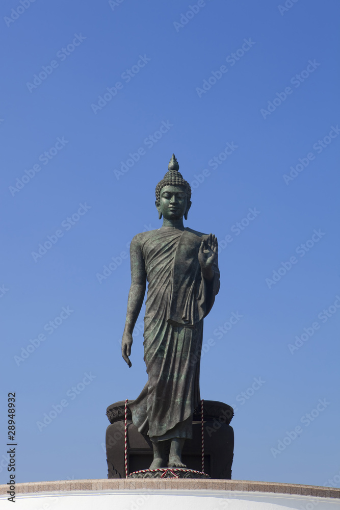 The Buddha status with blue sky