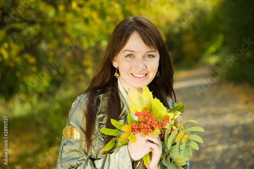 portrait of girl with autumn bouquet