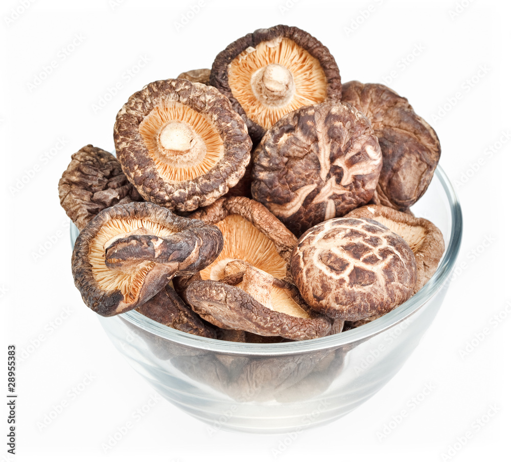 Dried field mushrooms in a glass bowl isolated on white Dried field mushrooms in a glass bowl isolated on white