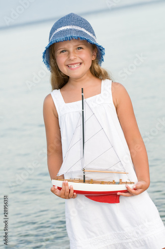 Little girl dreaming about sailing