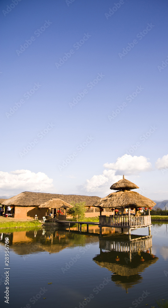 Fototapeta premium Cottage on a pond