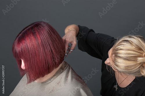 Obraz na płótnie Hairdresser cutting customer's hair