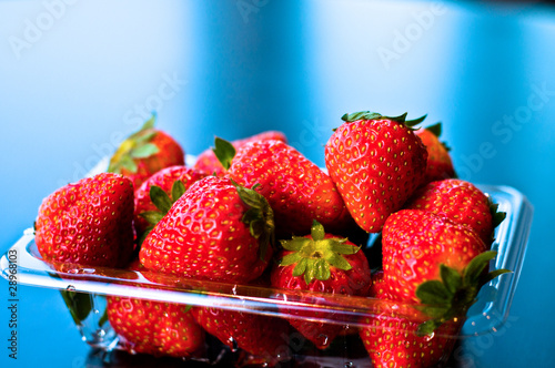 Strawberries in a plastic sale box