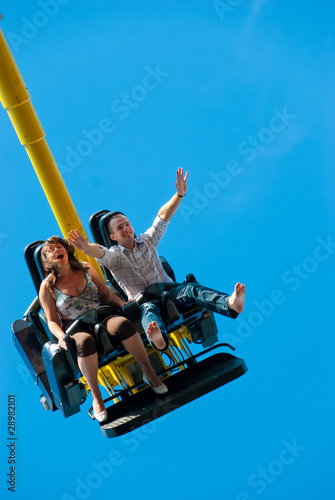 Fotografie Couple riding on the attraction